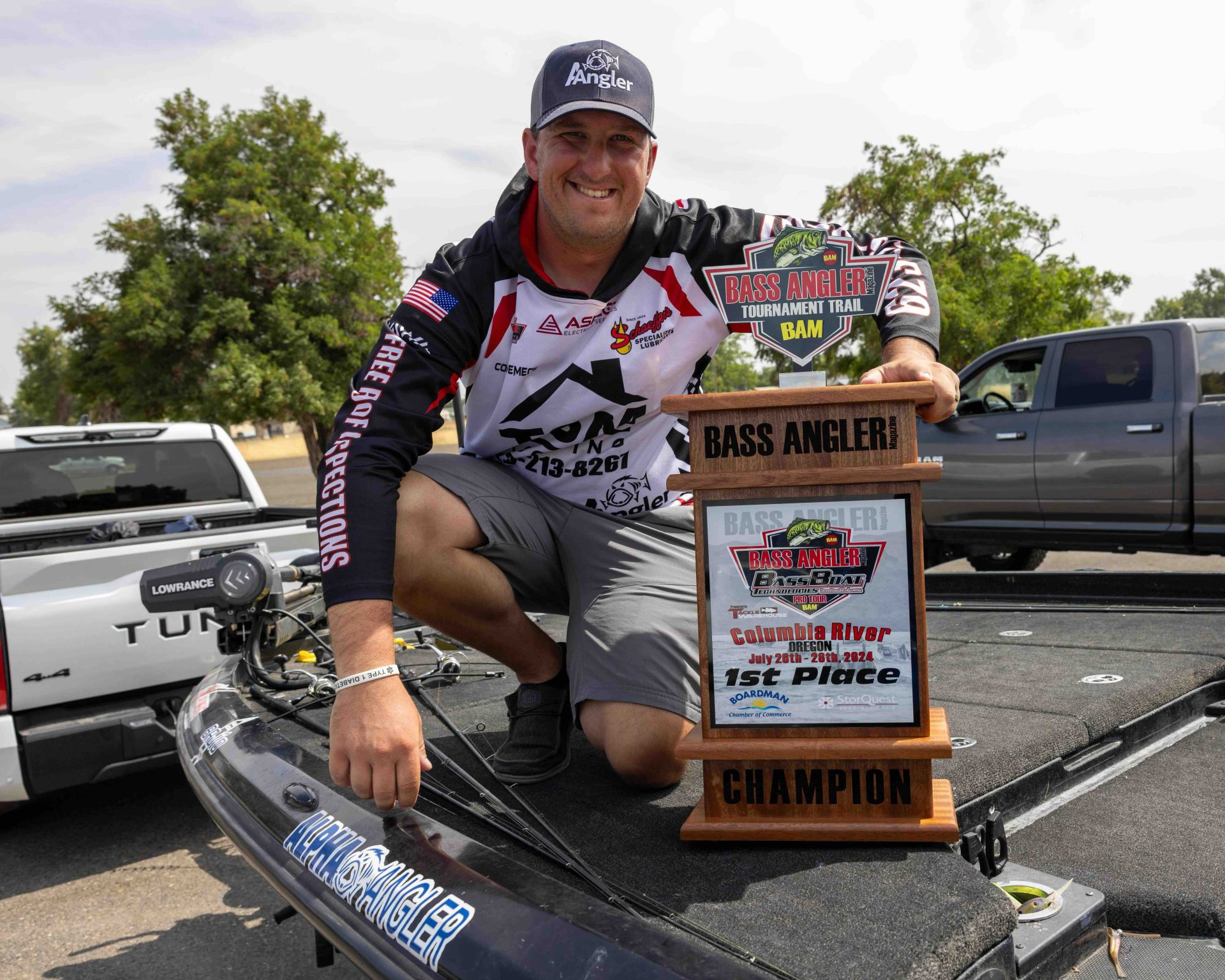 Conrad Demecs winning trophy in boat