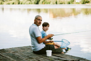 Father and son dock fishing