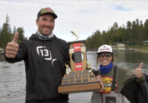 Jamie Bruce and his wife Ashley hoist the 2021 Bassin For Bucks trophy