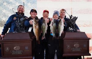 Million-dollar fish, million-dollar smiles, as Auburn University students celebrate US Open Championship at Table Rock Lake.