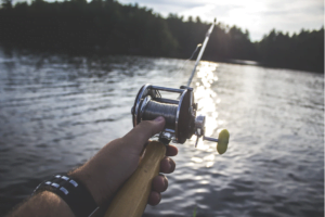 bait casting reel fishing in a lake