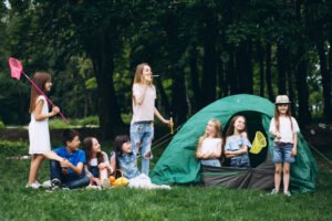 group teens camping forest