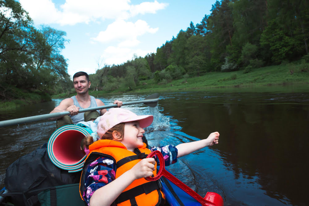 kayak trip father daughter rowing boat river water hike summer adventure ecofriendly extreme tourism active healthy lifestyle