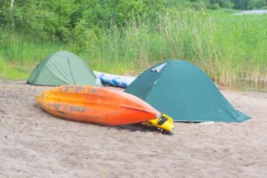 kayaks camp shore lake